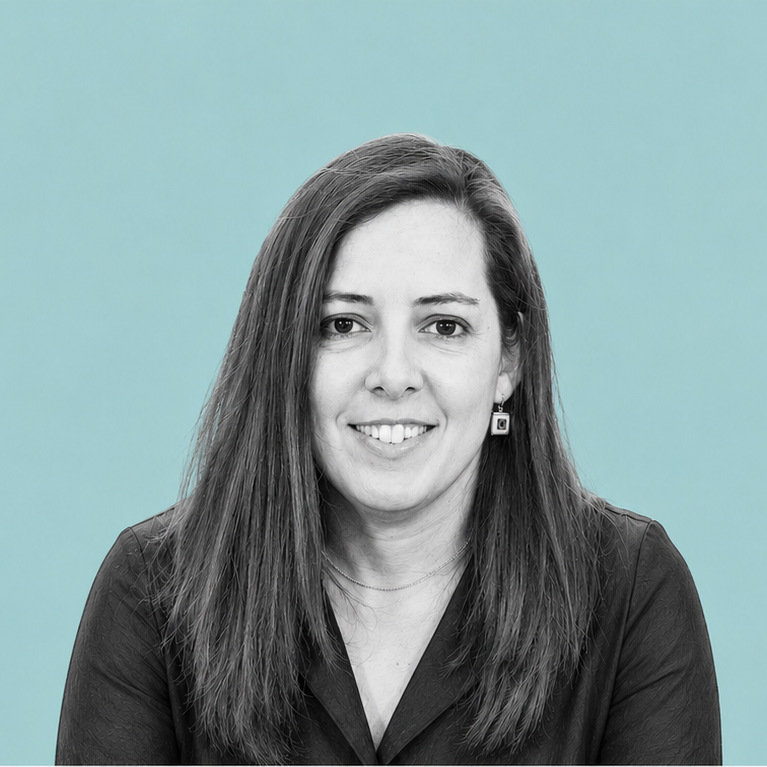 Black and white portrait of a woman with long dark hair wearing a dark blouse and square earrings, smiling against a gradient green background.