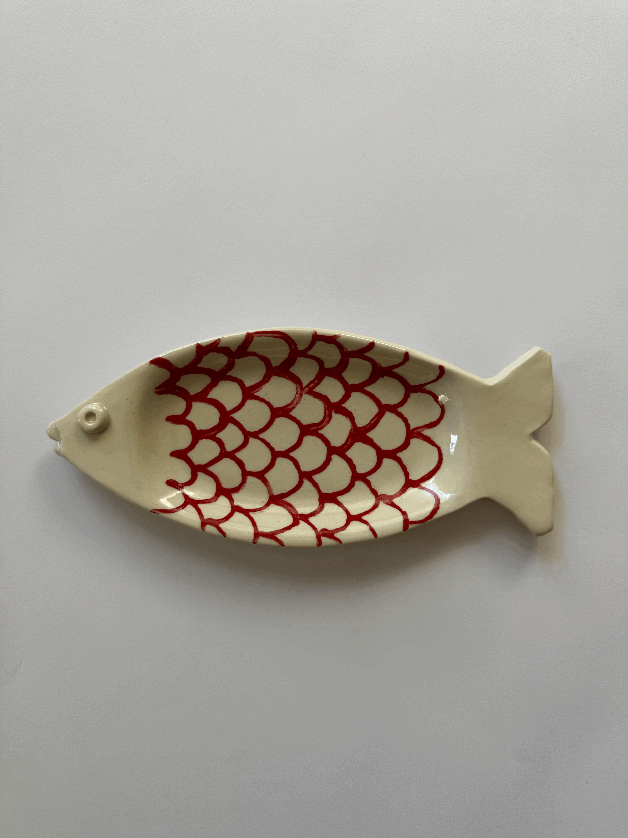 Red and White Scalloped Fish Dish