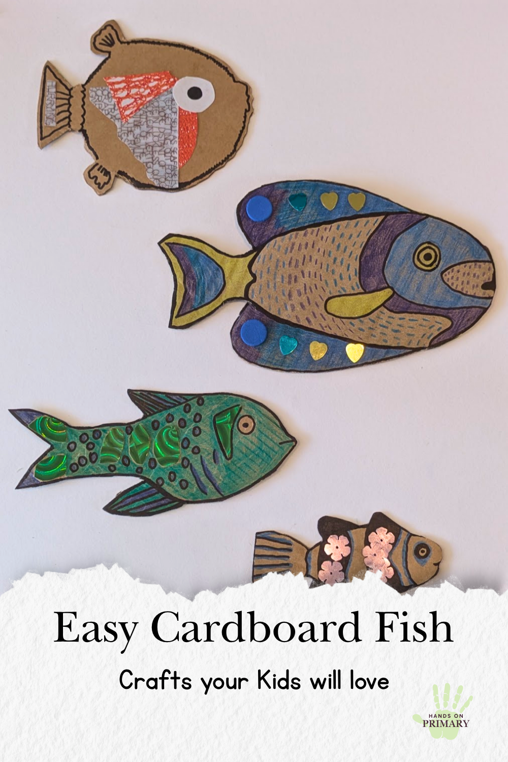  Four handmade cardboard fish decorated with colourful patterns and collage, an easy recycled craft for kids. 