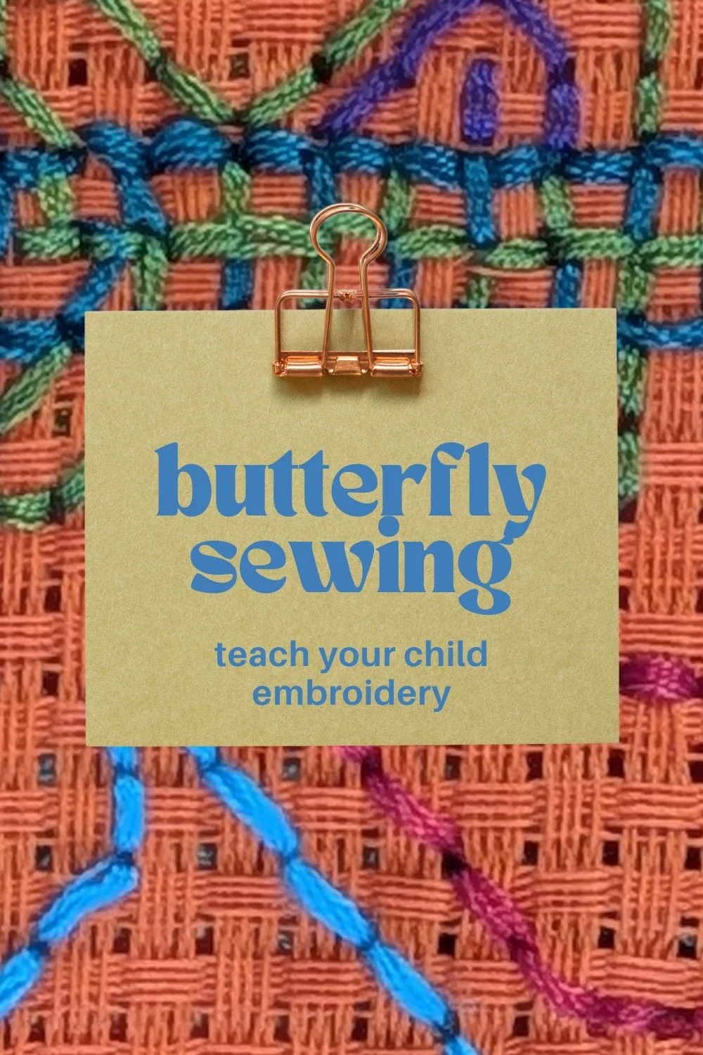 A background showing embroidery stiches on orange binca detailed a small section of a butterfly.