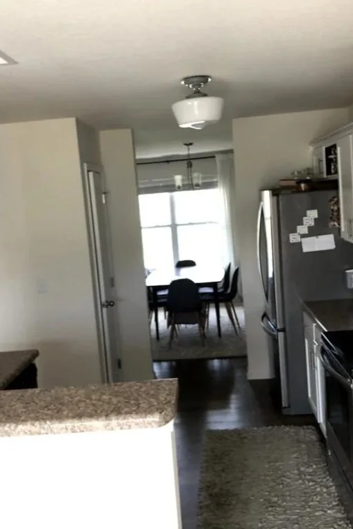 kitchen with small pantry and view of dining room