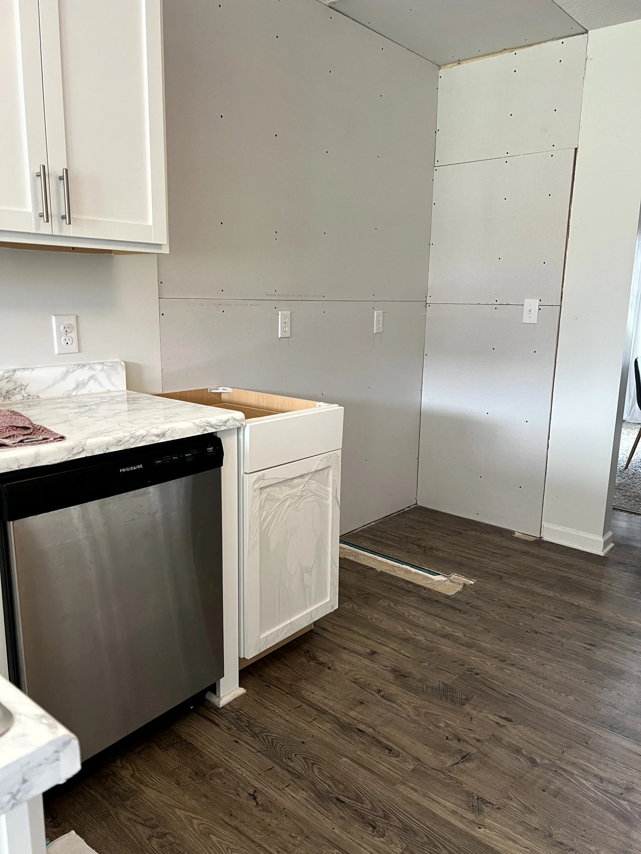  Mid renovation, contractor ghosted us, this shows the first of the cabinets that I just slid into place and screwed in so we could use the space until we found a new contractor  