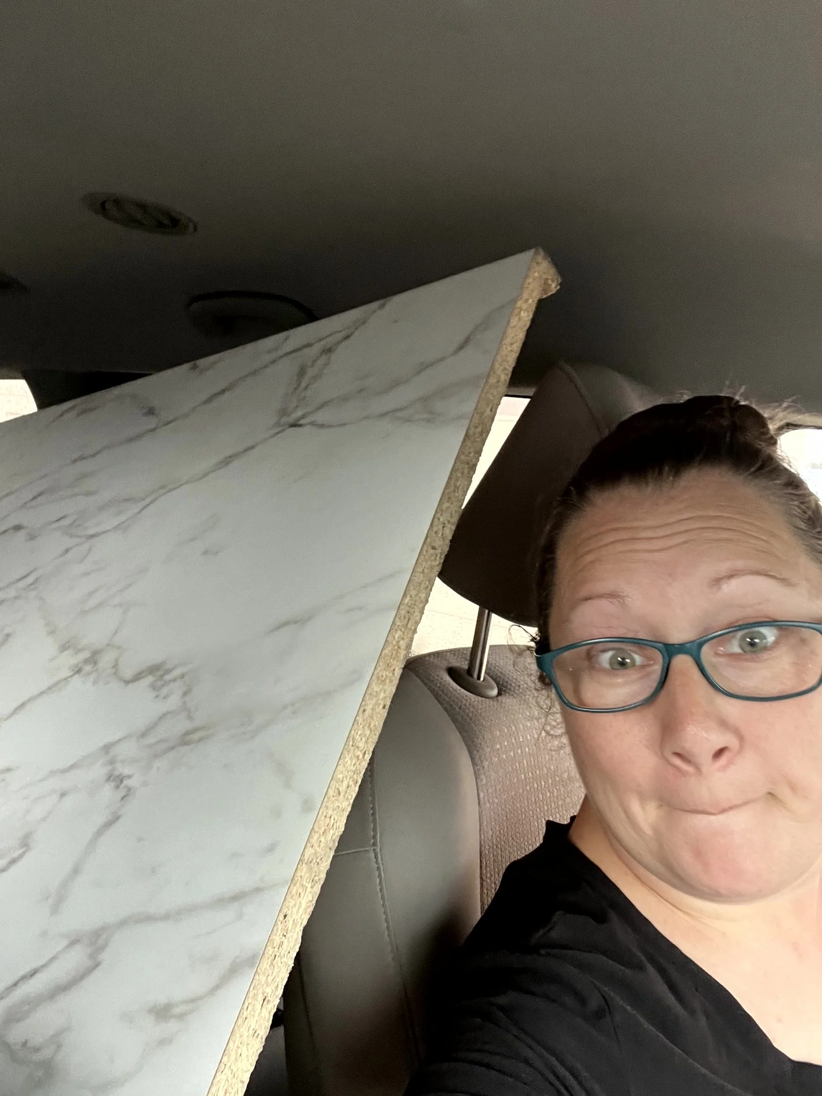  The laminate counter top I picked up to put on top of the cabinets I slid into place.  