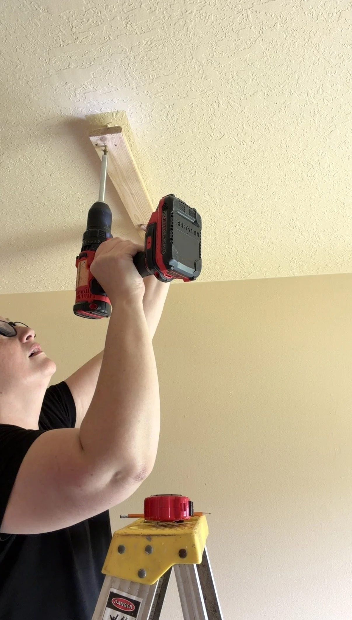 Screw brace board to joists