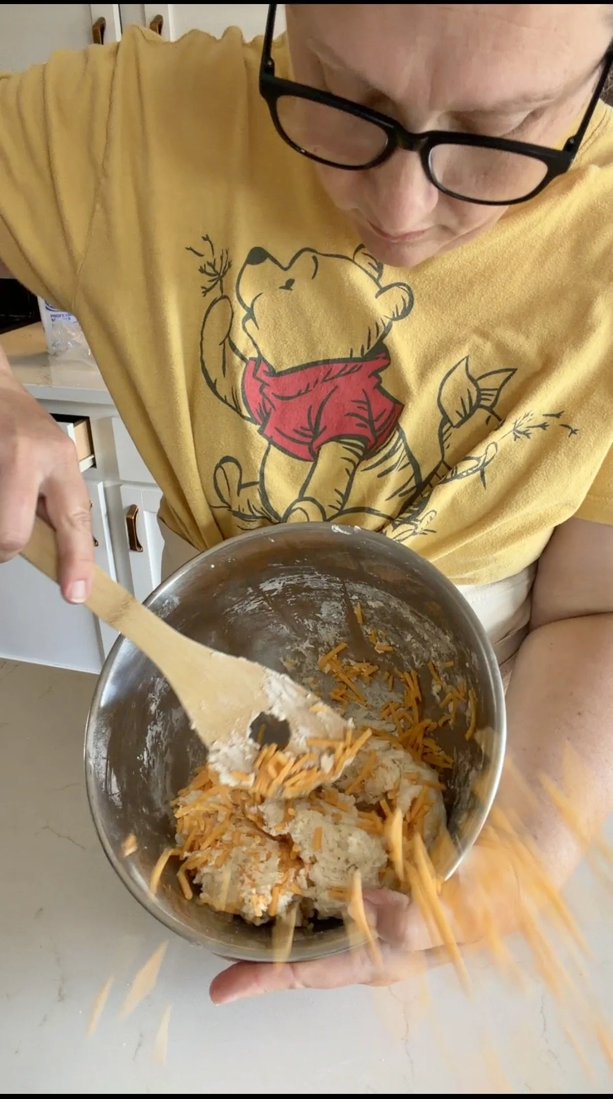 Mixing in the cheddar and garlic