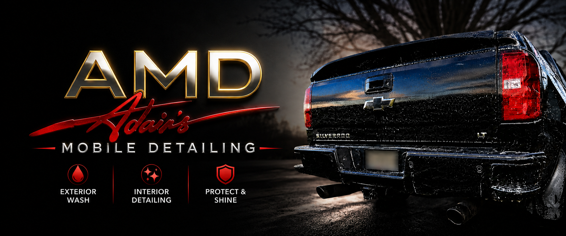 Black Chevrolet Silverado truck with wet exterior and taillights on, parked outdoors at dusk with trees in the background, advertising AMD Adair's mobile detailing services. The services listed include exterior wash, interior detailing, and protect & shine.
