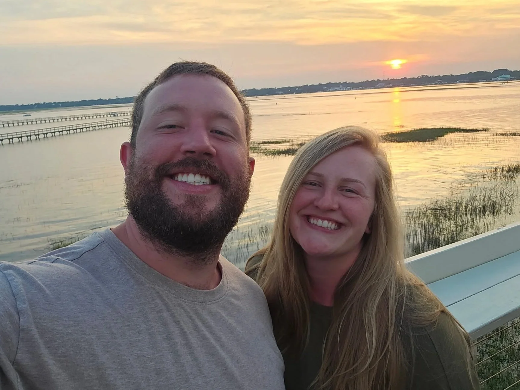 Dr Combs and his wife Sierra on vacation at the beach, taking care of their mental health and wellness so they can pour into their community.