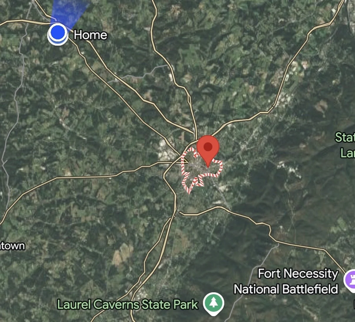 Map showing a location marked with a red pin near Fort Necessity National Battlefield, Laurel Caverns State Park, and other nearby areas.