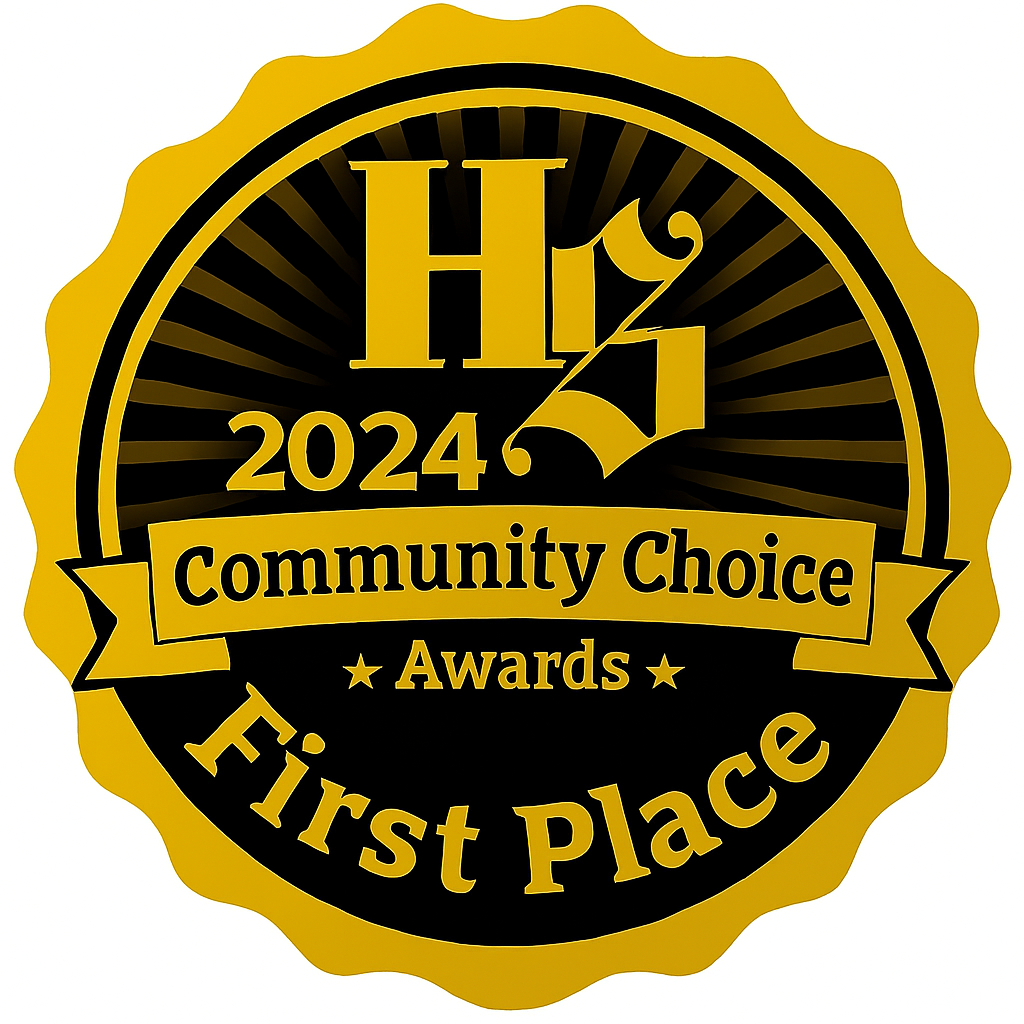 Gold and black award badge featuring the text '2024 Community Choice Awards First Place' and a stylized number 1 with a ribbon.