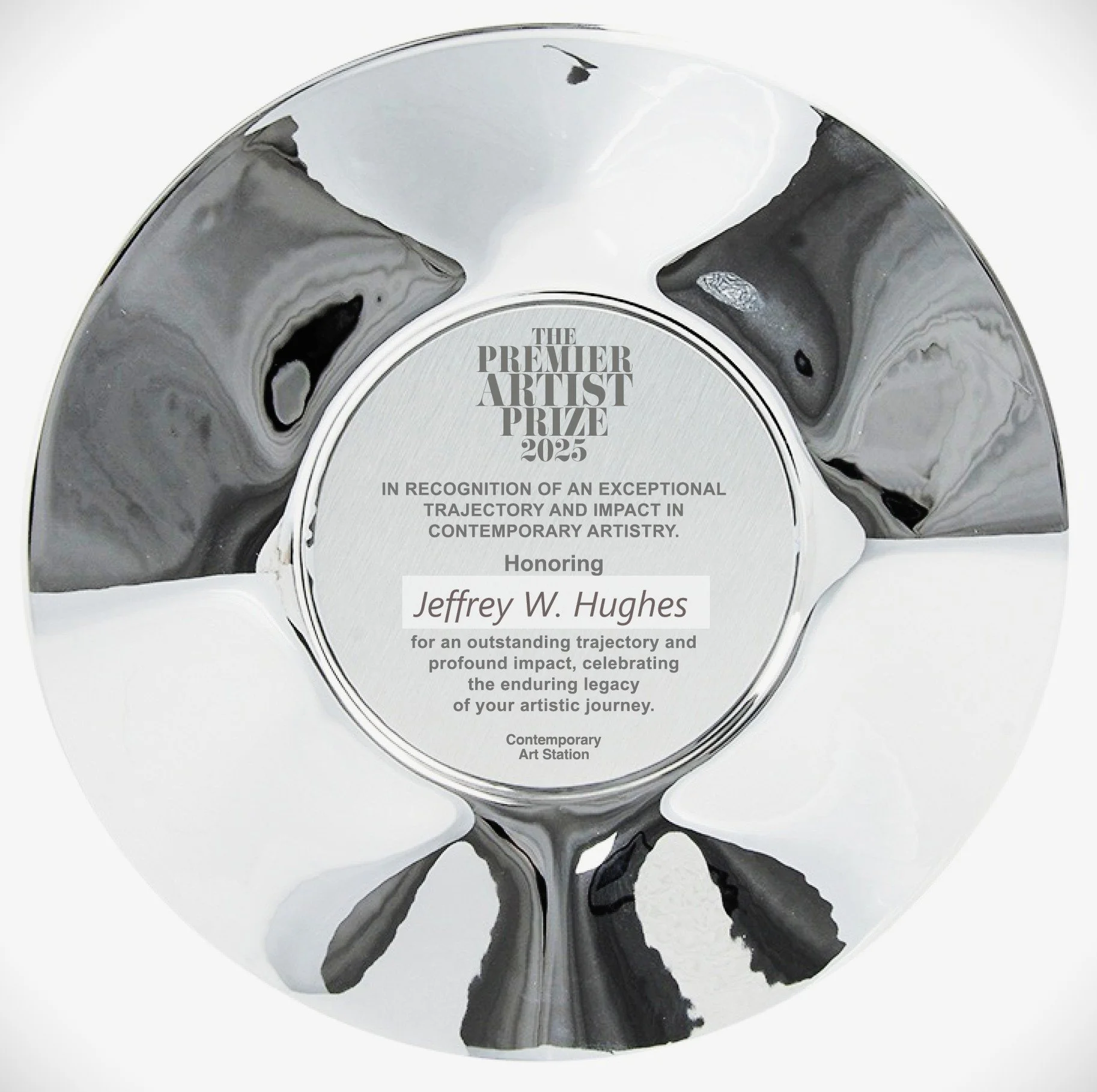 Silver award with black and gray marbled design, engraved with 'The Premier Artist Prize 2025'.