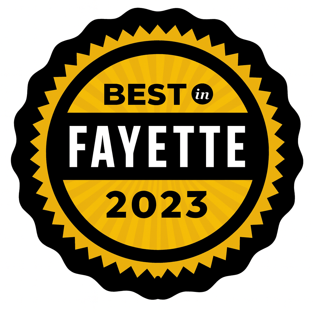 A badge with a black and gold color scheme that says "Best in Fayette 2023".