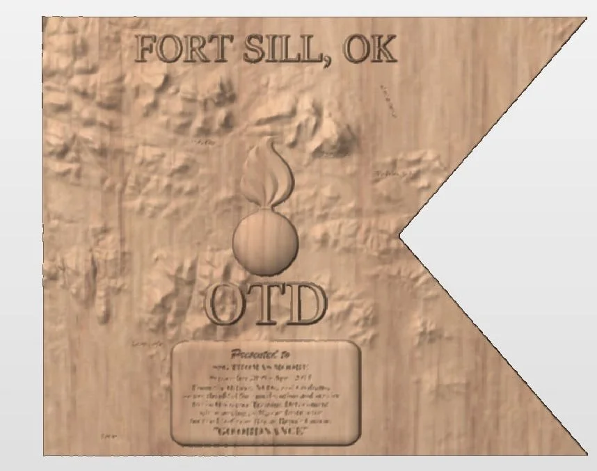 Wooden plaque with the text 'Fort Sill, OK,' a drawing of a bomb, and the acronym 'OTD' below it.