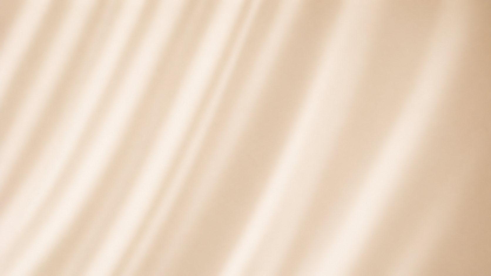 A close-up image of a beige or light-colored textured surface with subtle diagonal lines or folds.