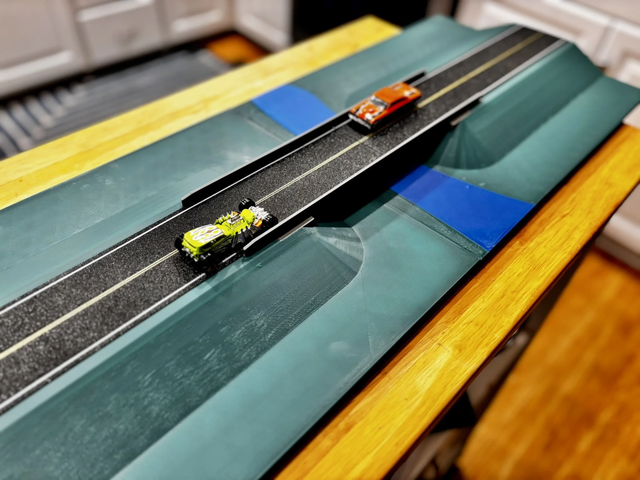 Cored slab bridge over water, large enough for hot wheels cars.