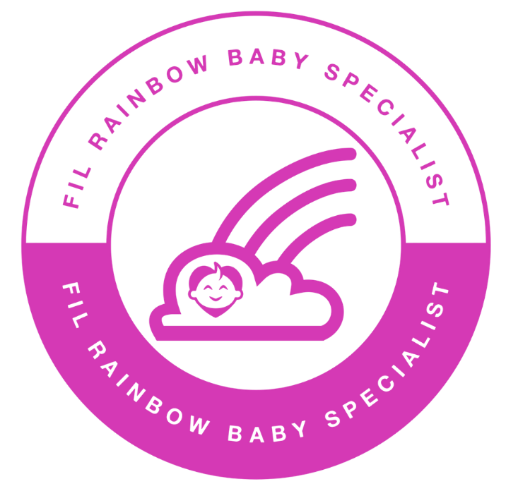 A circular badge with a pink and black color scheme. It features a smiling cloud with rainbow rays and the text 'FIL RAINBOW BABY SPECIALIST' repeated around the circle.