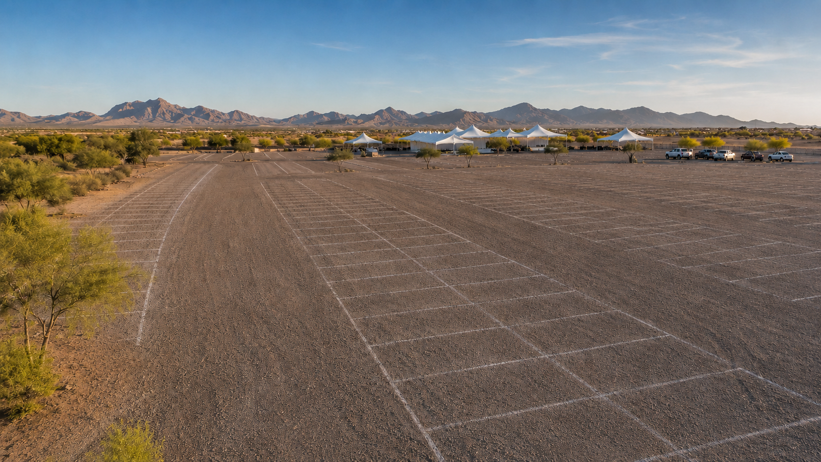 Graded gravel special-event parking lot with temporary chalk parking layout in Arizona