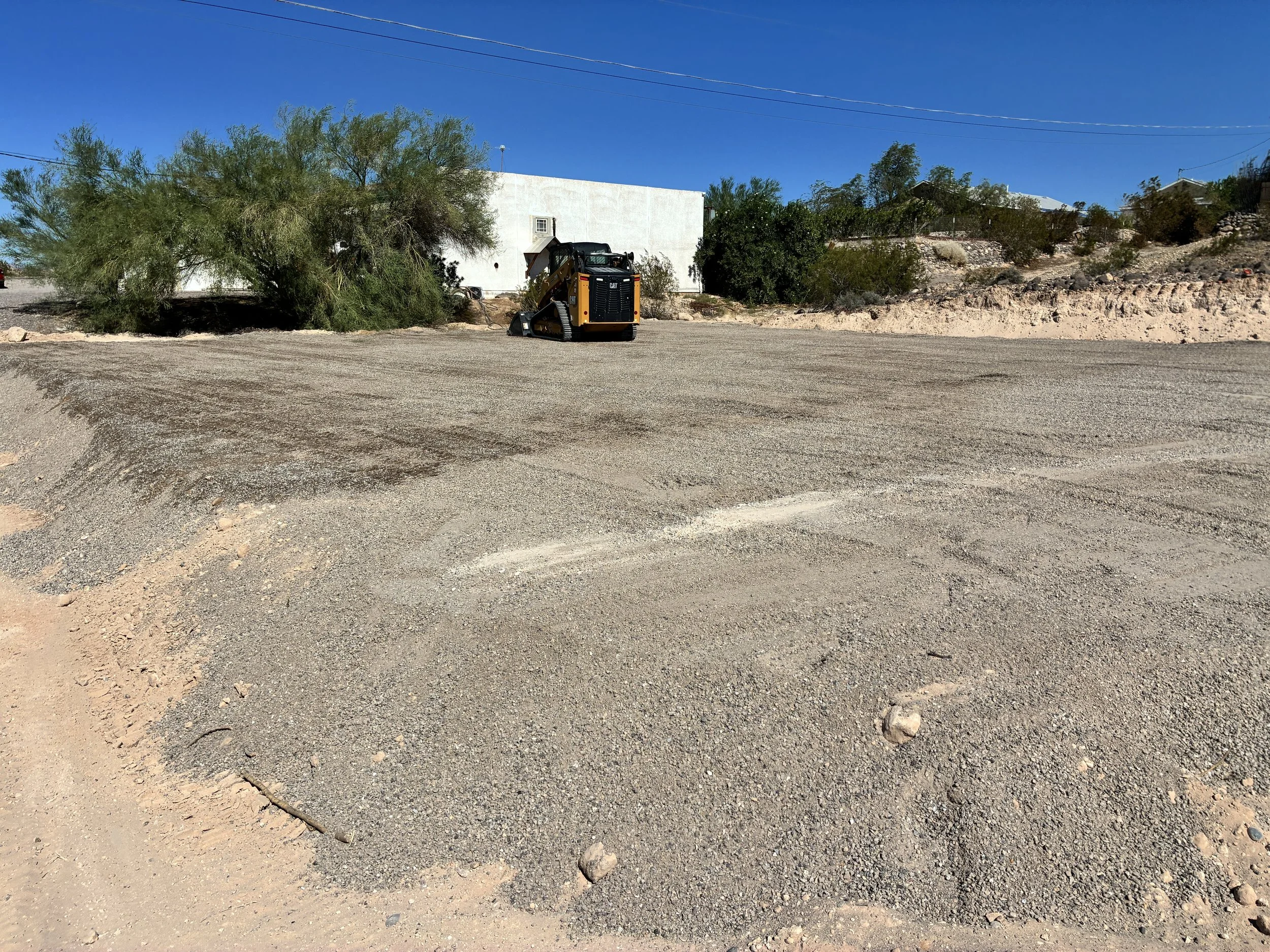 Finished ABC pad and grading with a CAT 255 compact track loader in Topock, Arizona.