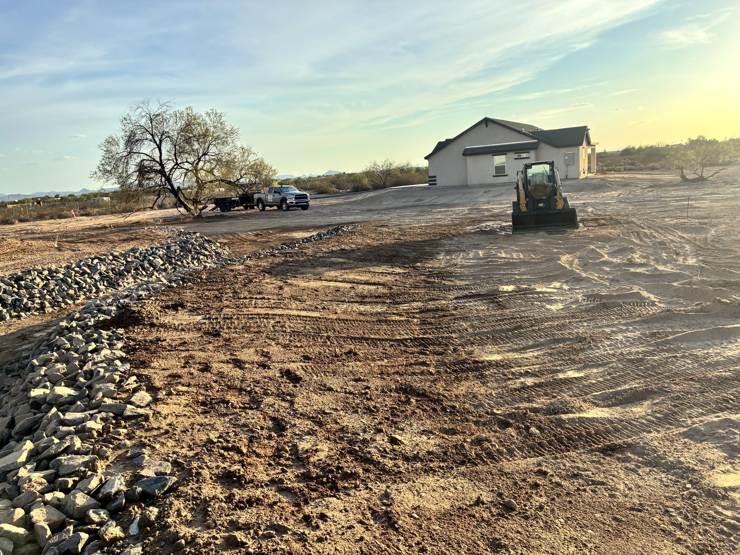 Finished stormwater drainage path with grading and riprap erosion protection