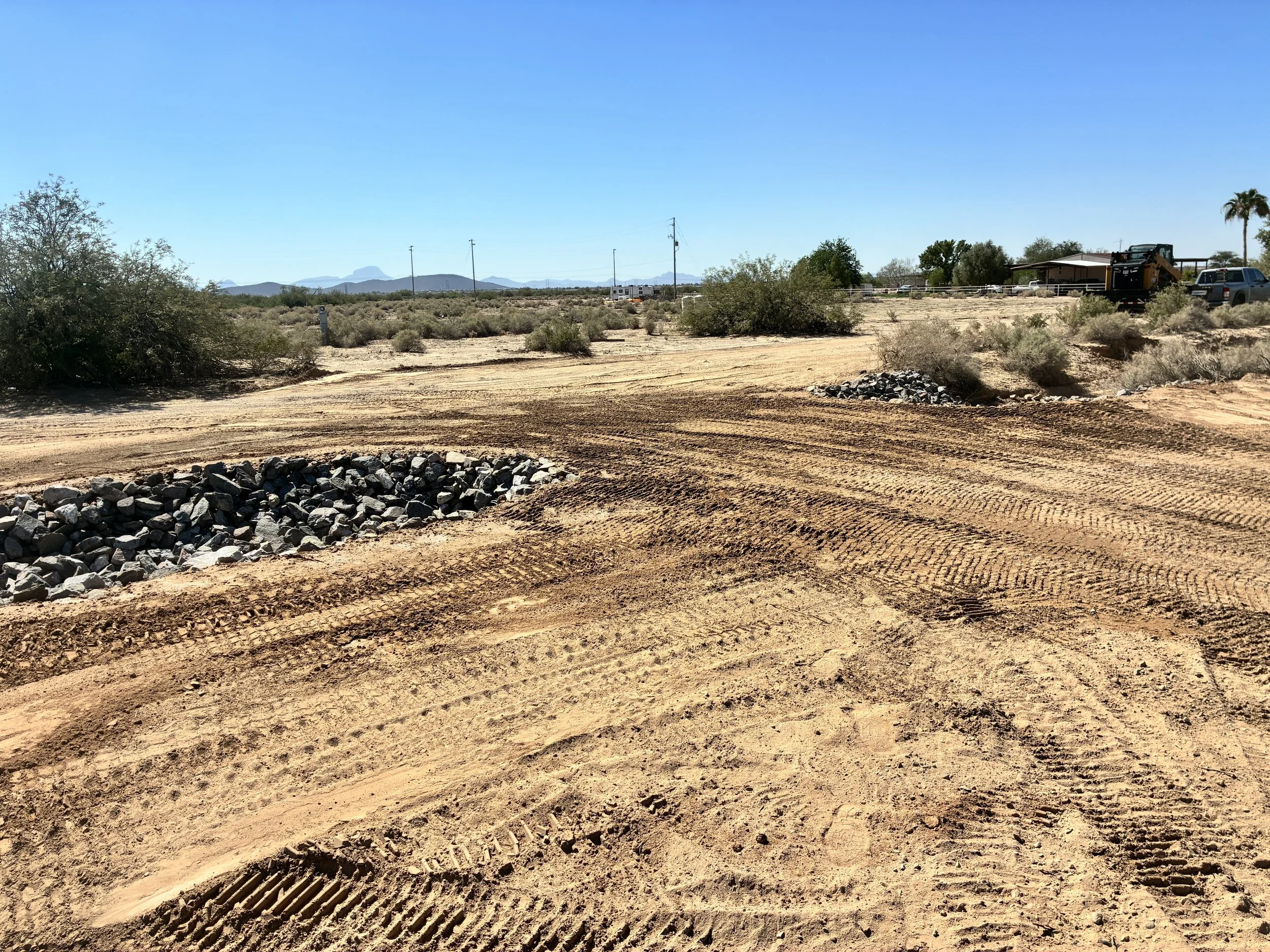 Finished driveway crossing with riprap protecting both sides of the culvert.