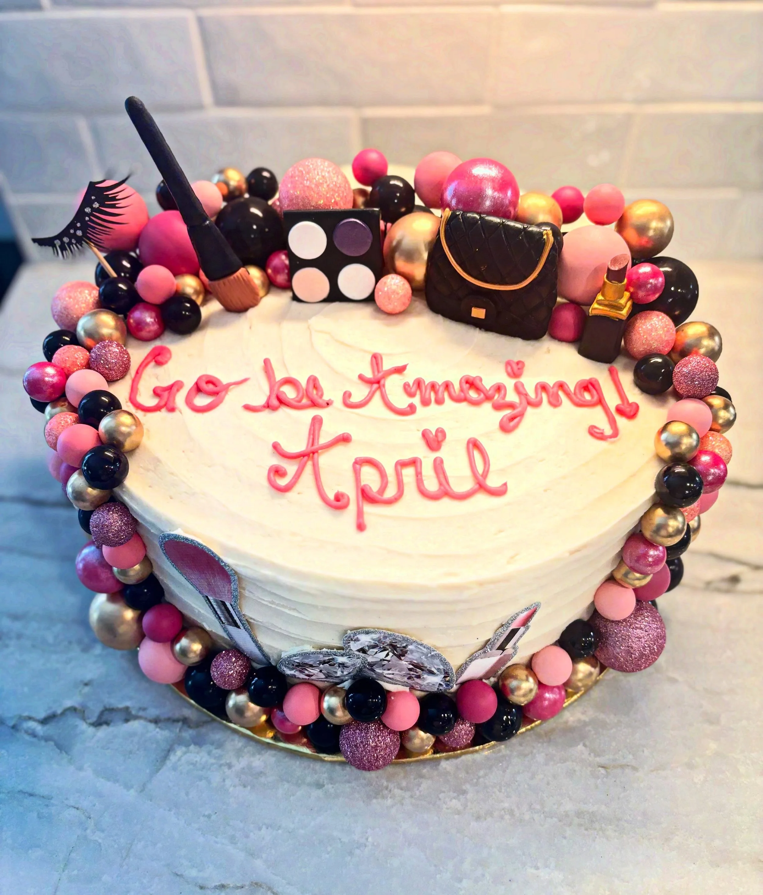 Go be amazing, April!! 12&rdquo; vanilla cake filled with salted caramel buttercream, frosted with vanilla bean buttercream and decorated with some beauty themed decorations!