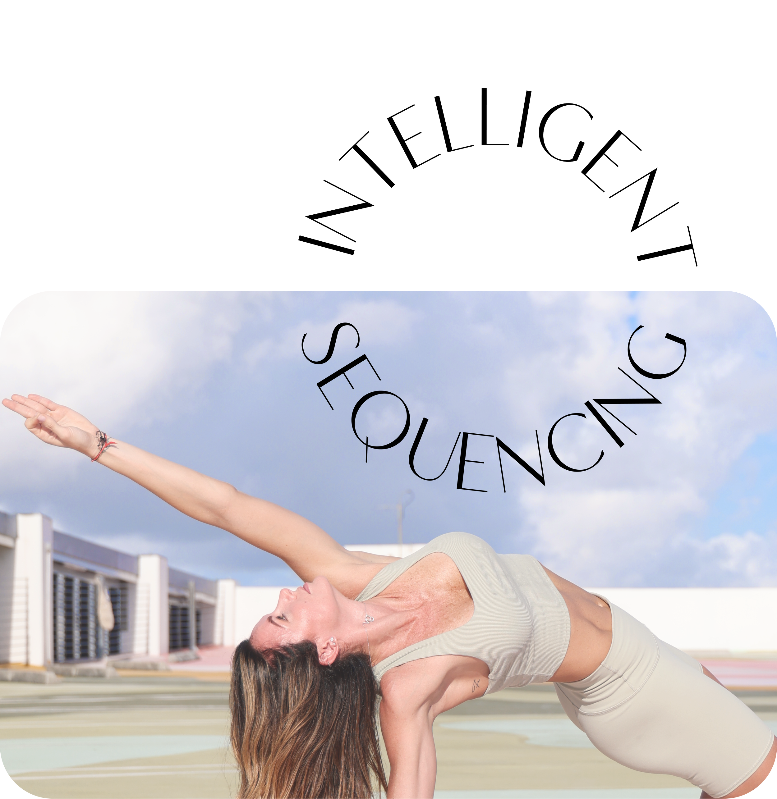 A woman with long brown hair doing a yoga pose on an outdoor running track, with buildings in the background, wearing a beige tank top.