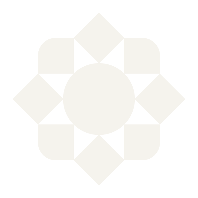 Geometric black and white pattern with a central circle, surrounded by diamond shapes and alternating black and white triangles.