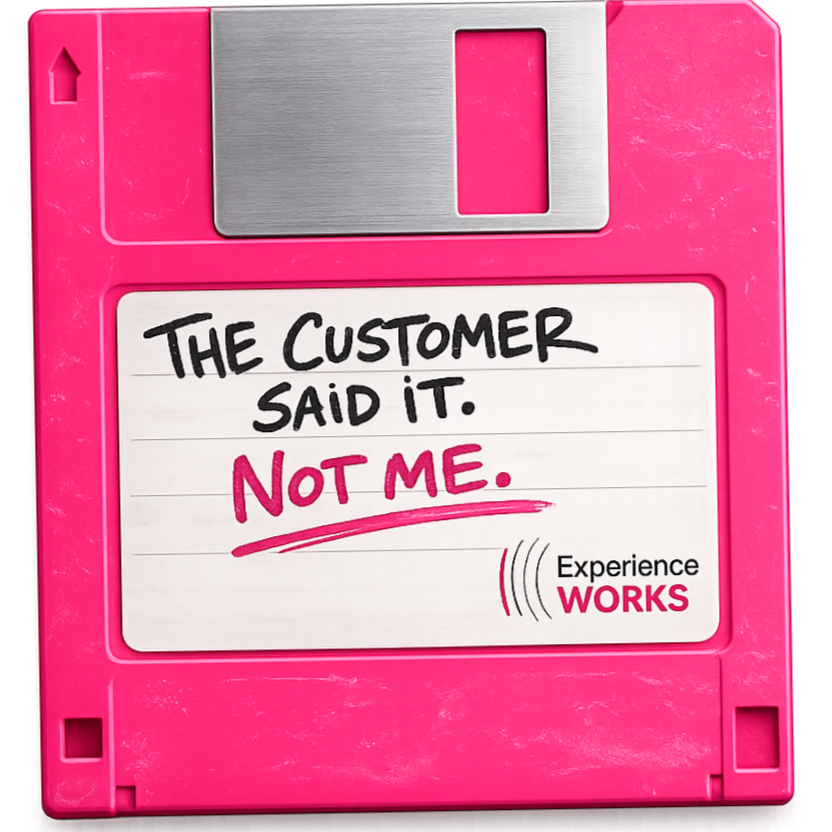 Close-up of a pink floppy disk with a handwritten note that says, 'The customer said it. Not me.' and a small logo with 'Experience Works.'