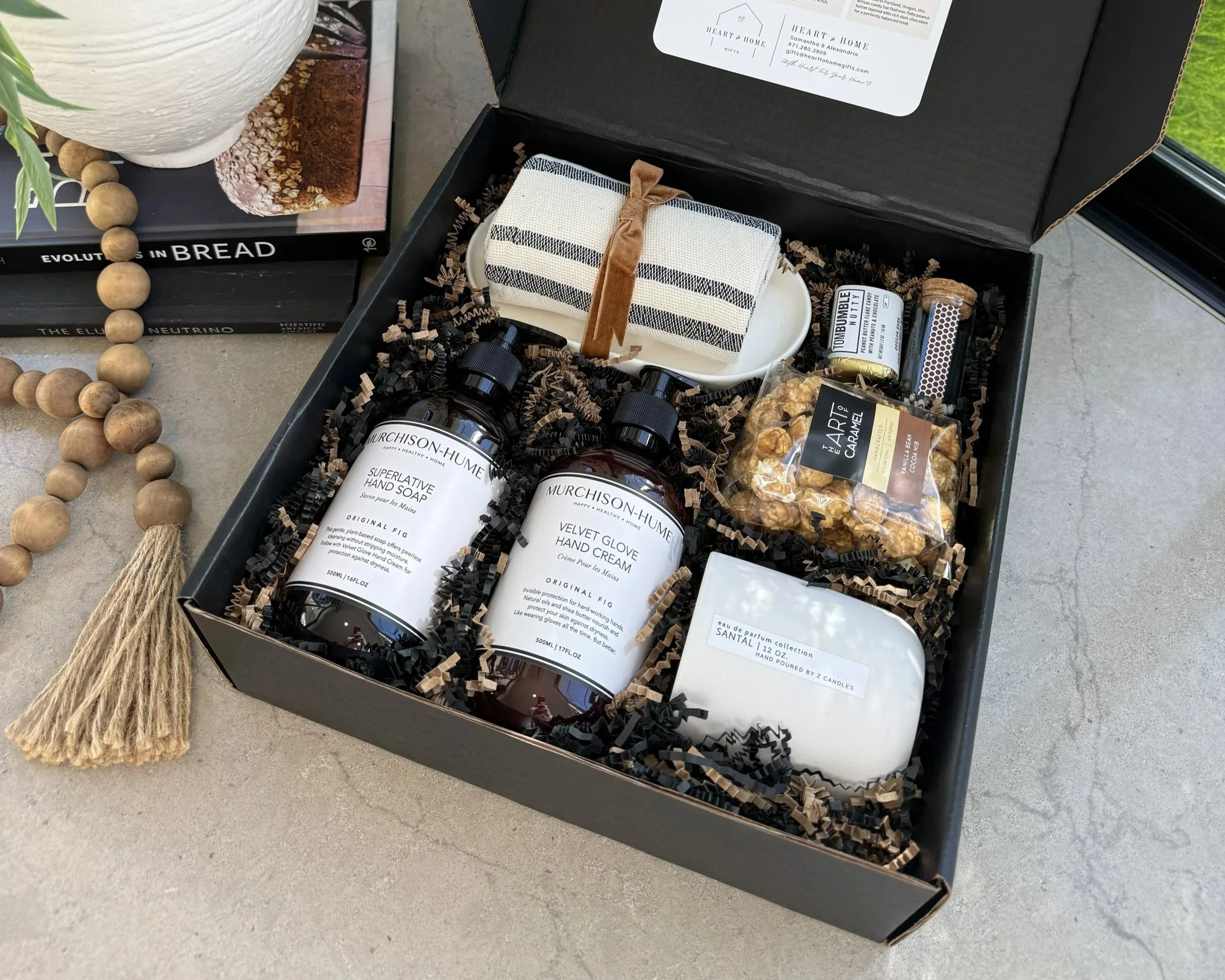 Curated real estate closing gift box featuring wellness products and gourmet snacks for new homeowners in Portland Oregon