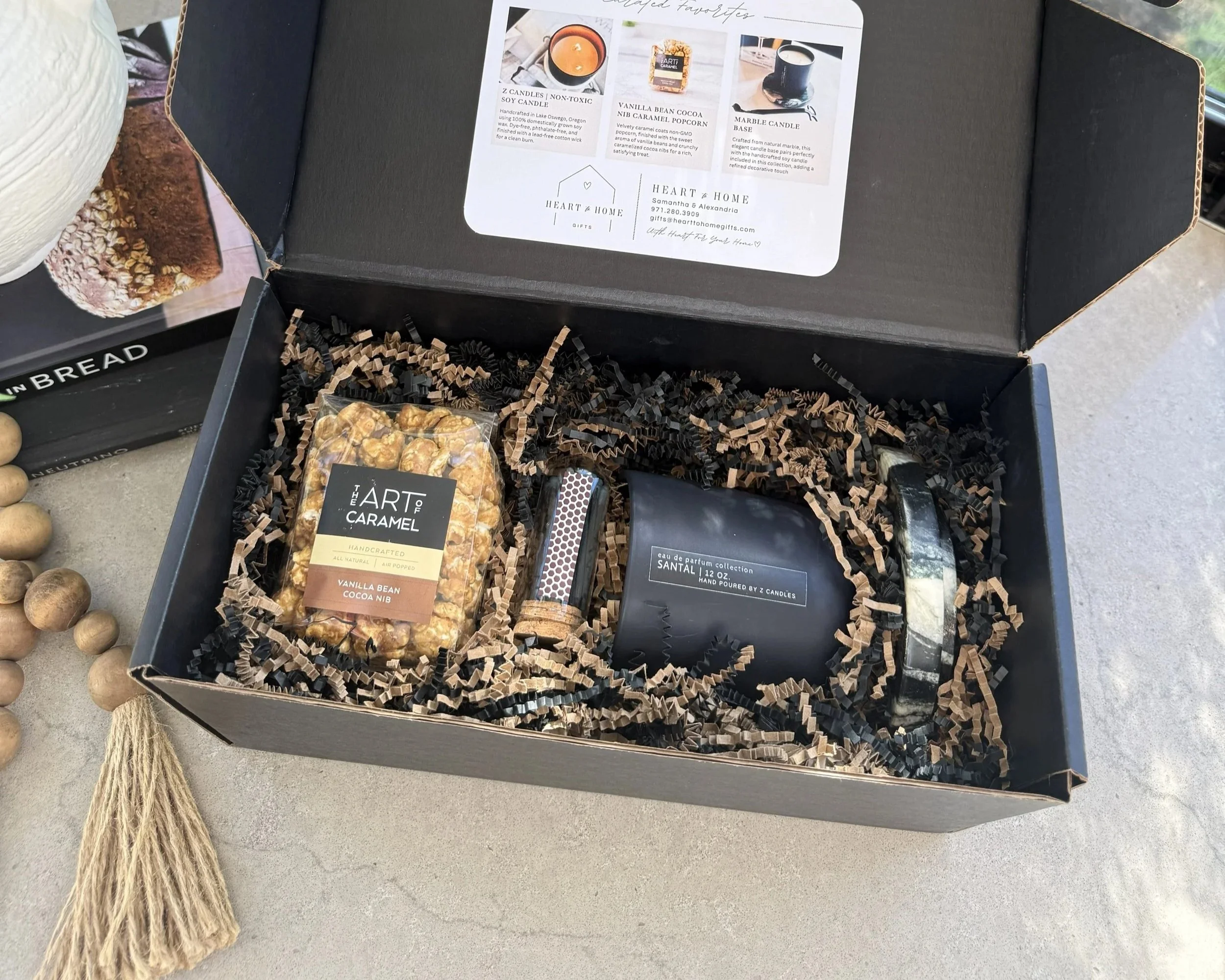 Heart to Home Gifts signature closing gift box with branded packaging, candle, and artisan caramel popcorn for real estate clients