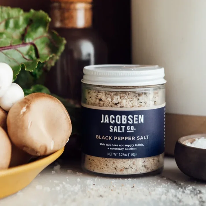 infused-black-pepper-salt-on-countertop.webp