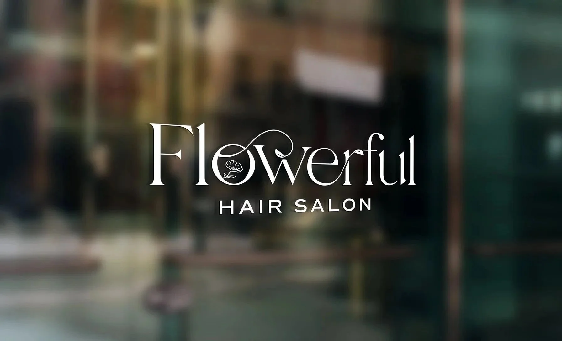 Flowerful Hair Salon brand identity logo design displayed as a frosted white vinyl decal on a glass storefront window, featuring elegant serif typography with a floral illustration integrated into the letterform.
