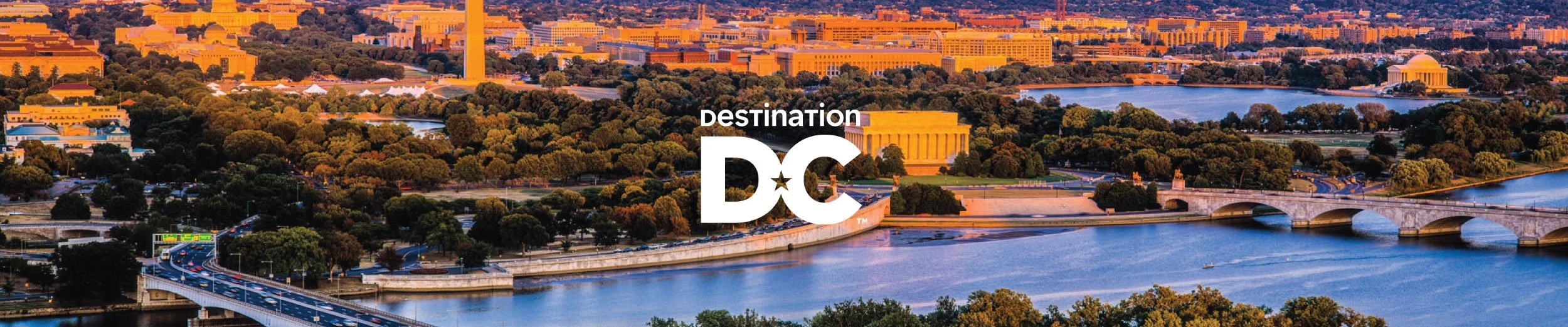 Destination DC logo overlaid on an aerial sunset photograph of Washington DC showcasing the National Mall, Potomac River, Lincoln Memorial, Washington Monument, and Jefferson Memorial.