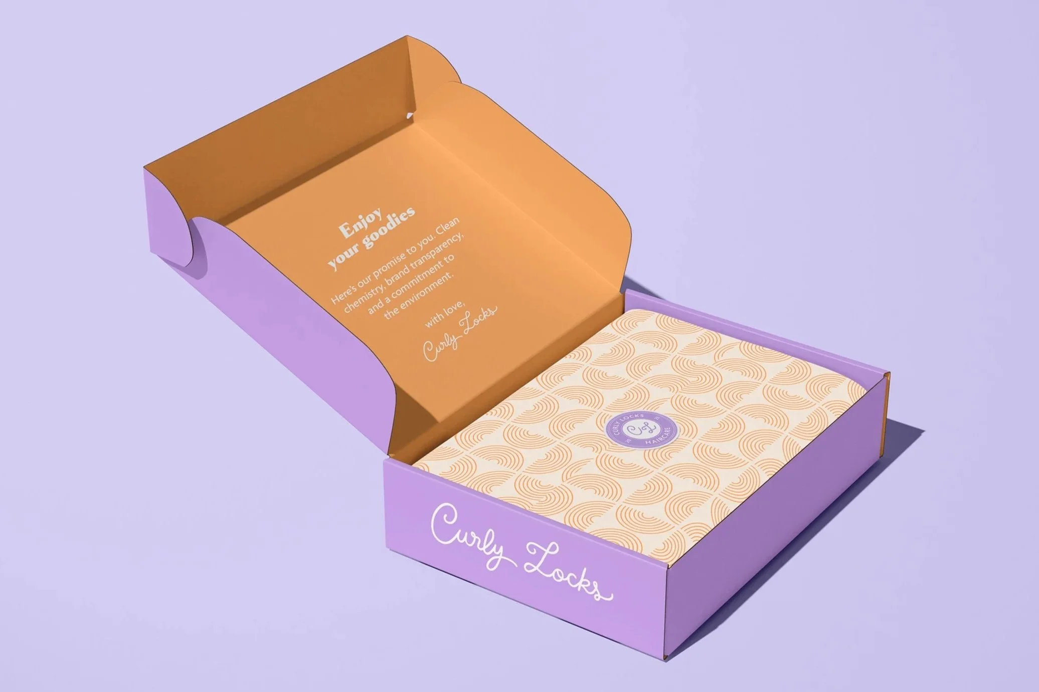 Curly Locks hair care brand product packaging design mockup showing an open purple mailer box with orange interior, custom curl pattern tissue paper, and branded logo seal sticker.