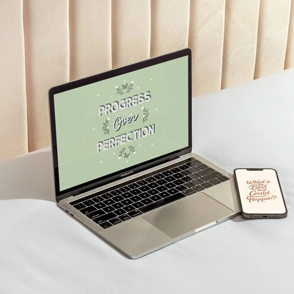 Progress Over Perfection motivational typography digital wallpaper design displayed on a MacBook Pro laptop screen in sage green, with a matching 'What's the Best that Could Happen?' phone wallpaper on an iPhone beside it.