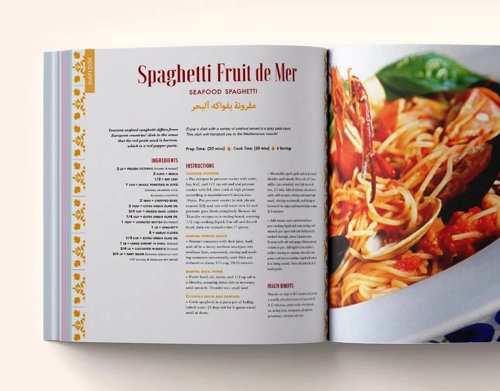 A Taste of Tunisia cookbook interior spread layout showing the Spaghetti Fruit de Mer seafood spaghetti recipe page with bilingual Arabic and English text, ingredients list, and a full-bleed food photography of pasta with shrimp and mussels.