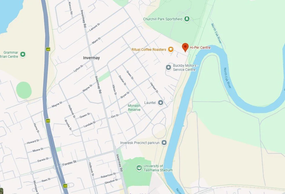 Map of Invermay, Tasmania, featuring streets, the North Esk River, University of Tasmania Stadium, and local landmarks like Churchill Park Sportsfield, Ritual Coffee Roasters, Buckby Motors, and Hi-Per Centre.