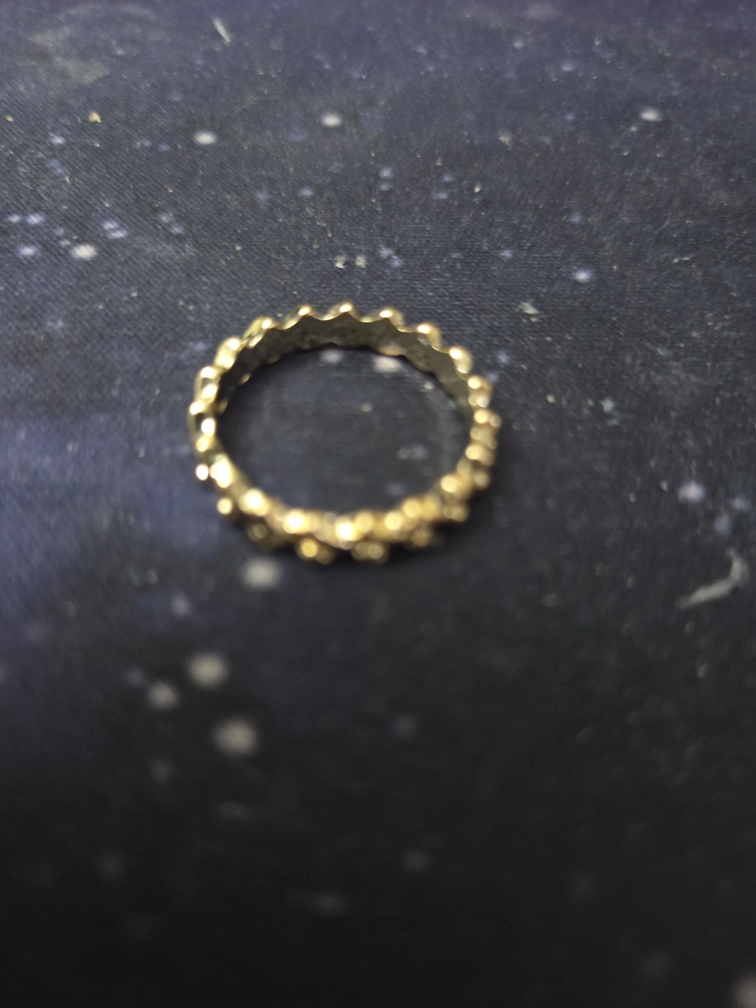 delicate gold-coloured ring in a child's size weight 0.02