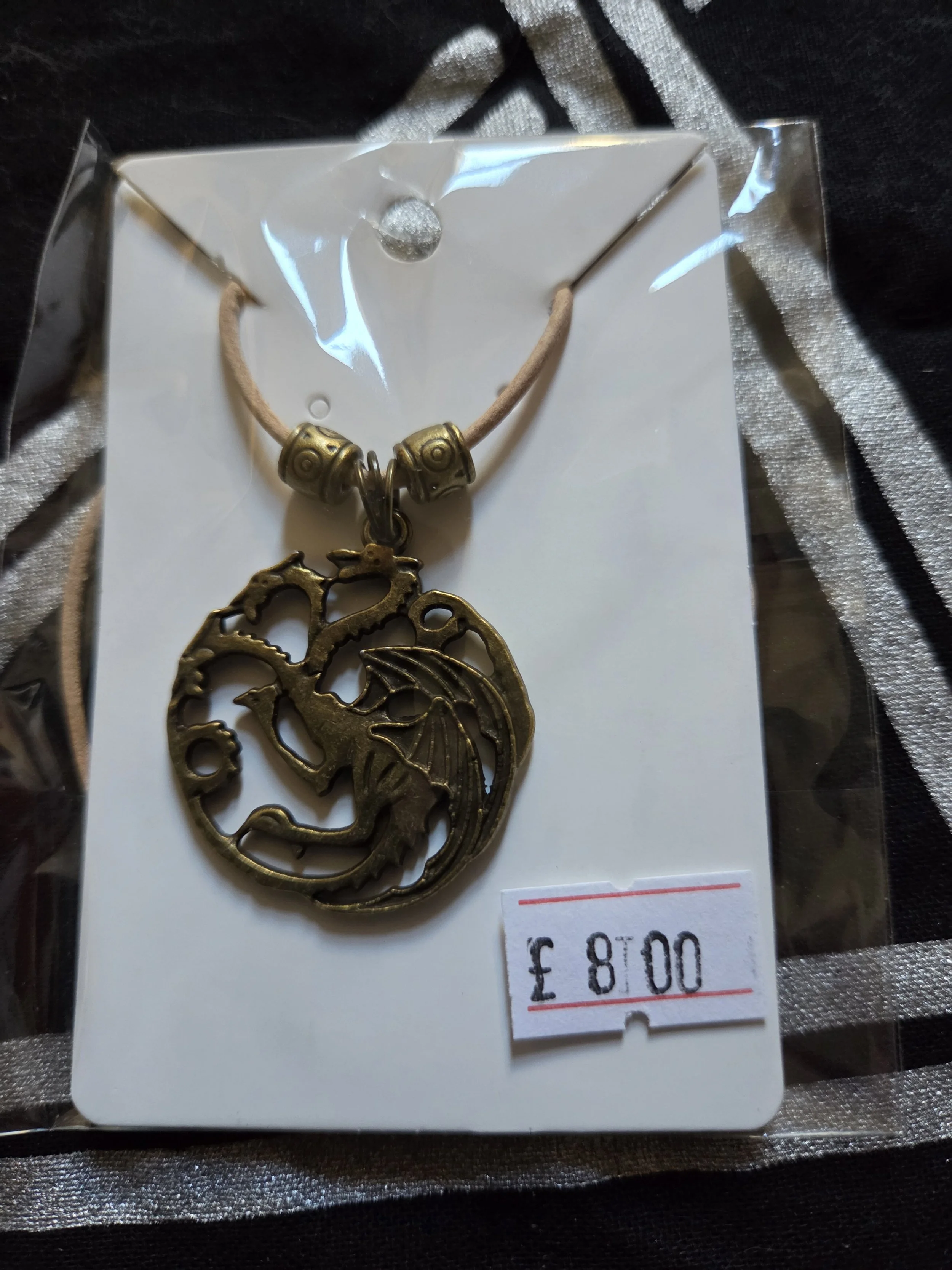 Round 3 headed dragon with beige leather cord