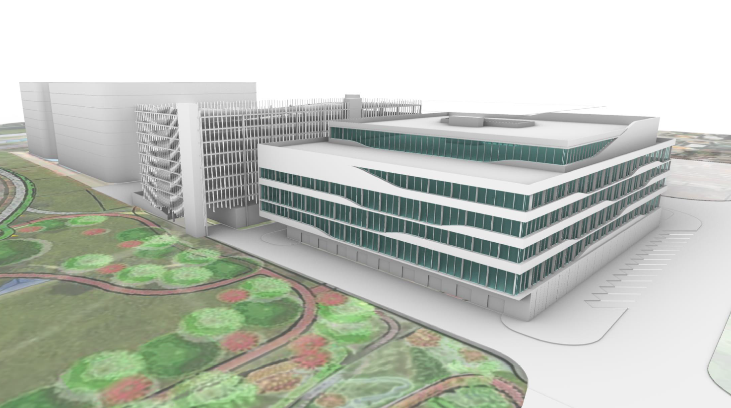 3D rendering of a modern multi-story hospital building with green-tinted windows, surrounded by landscaped gardens with pathways, and a parking lot to the side.