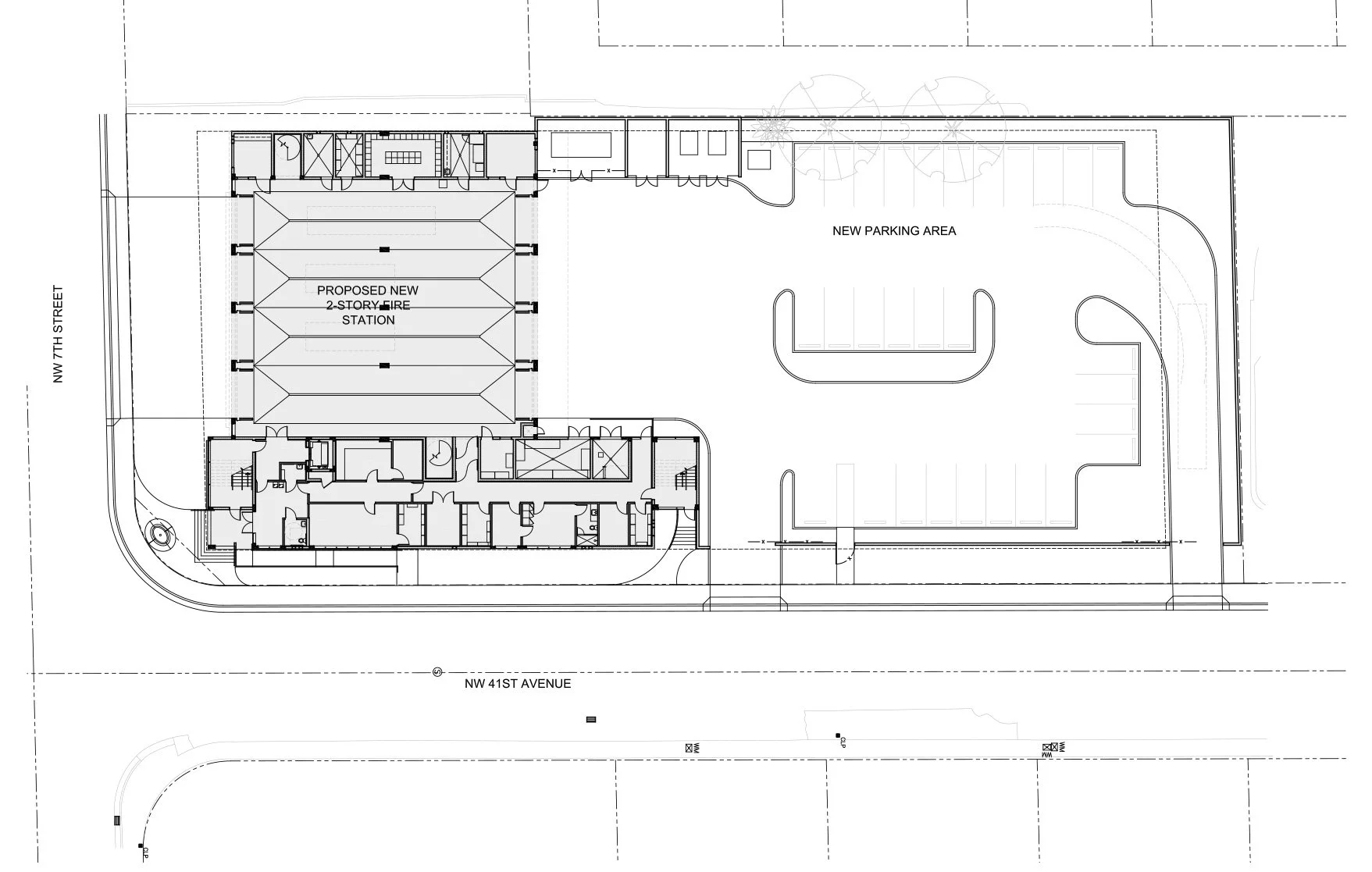 Site plan illustration of a proposed building with a new fire station, parking lot, and surrounding roads.