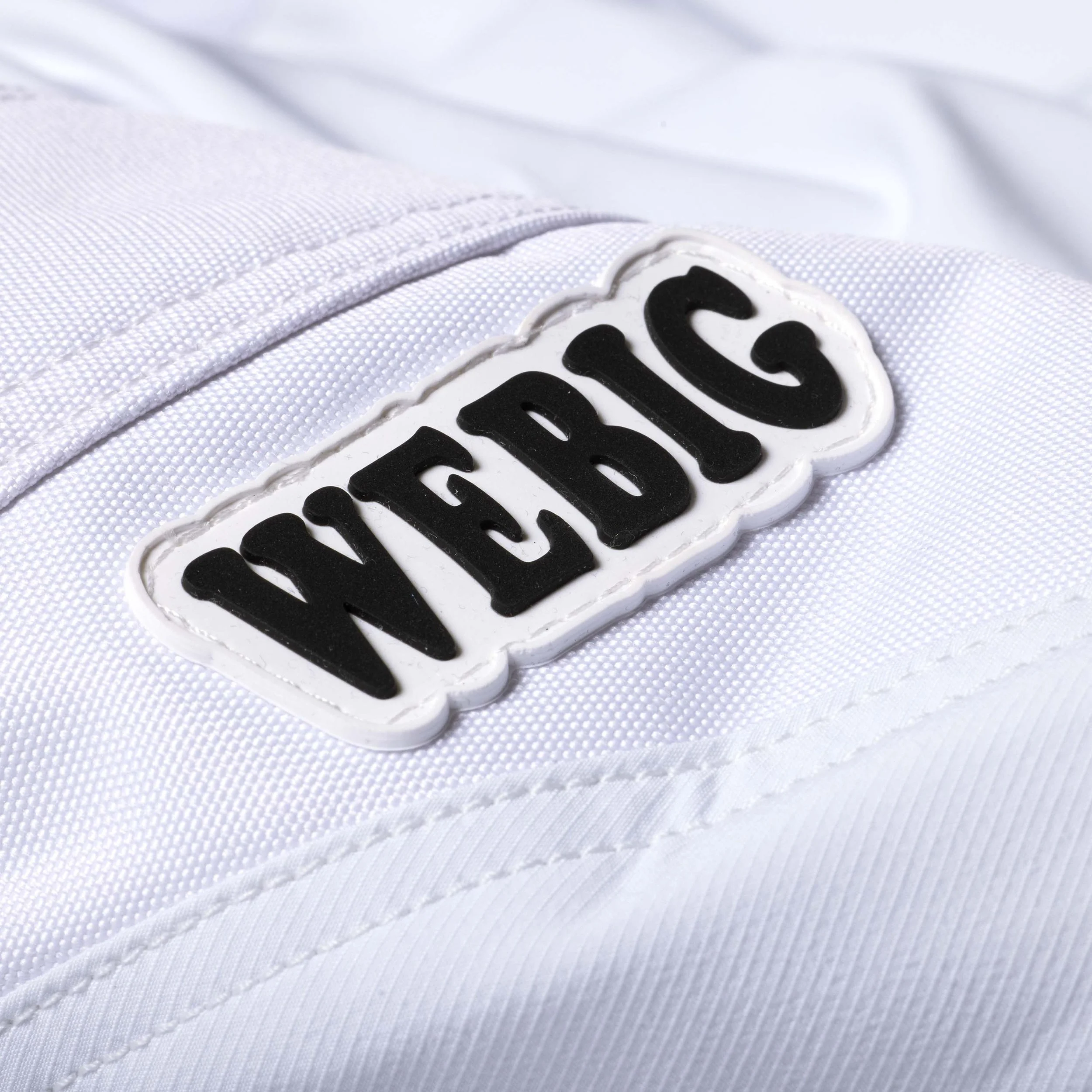 UNIVERSAL MOTO PANT_WHITE_KNEE LOGO.jpg