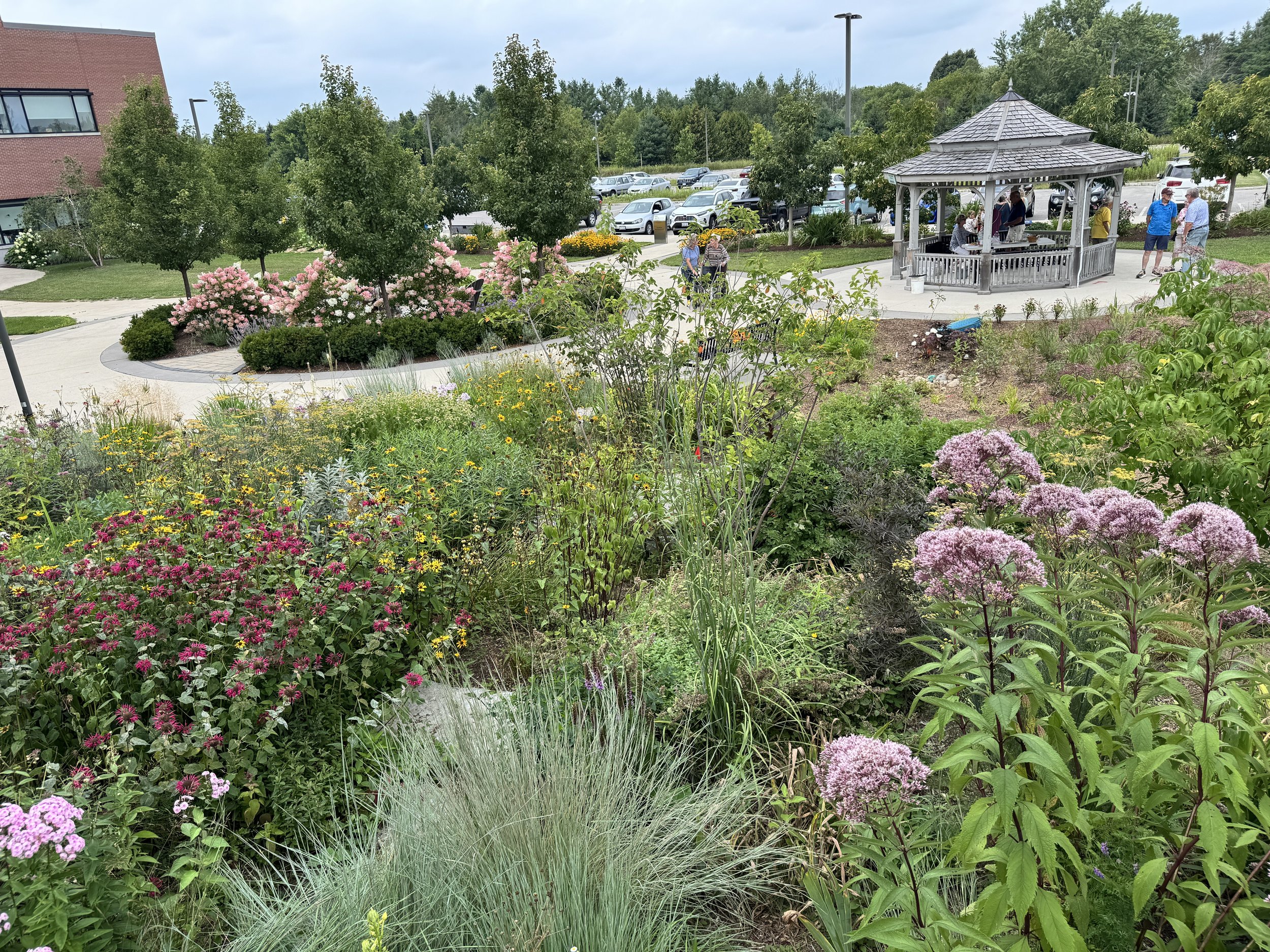 Photo of gardens with a pavilion in the background