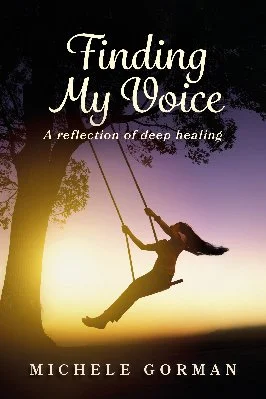 Book cover titled 'Finding My Voice: A reflection of deep healing' by Michele Gorman, featuring a silhouette of a woman swinging on a swing near a tree at sunset