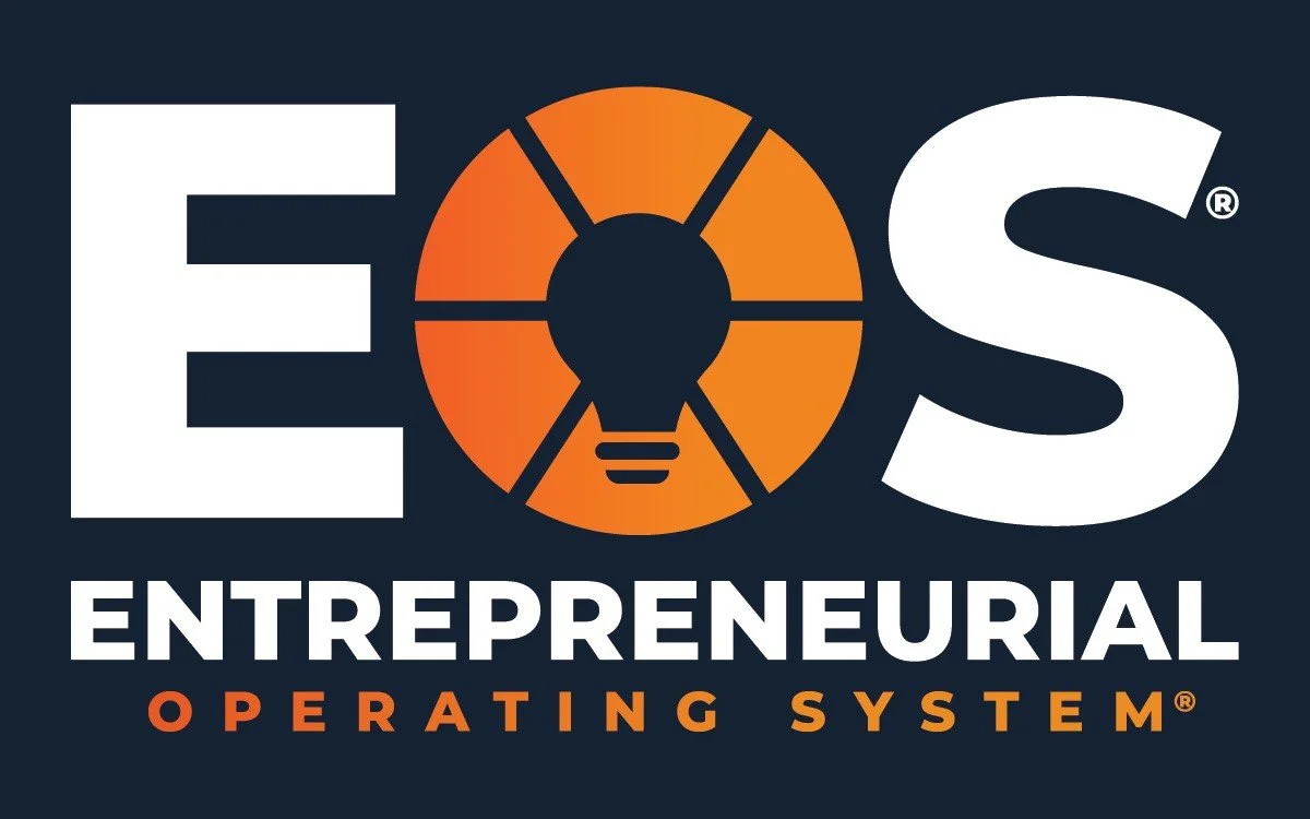 EOS Entrepreneurial Operating System logo, with a dark background, large white letters 'E' and 'S', an orange circular graphic with a lightbulb in the center, and the words 'ENTREPRENEURIAL OPERATING SYSTEM' in white and orange text.