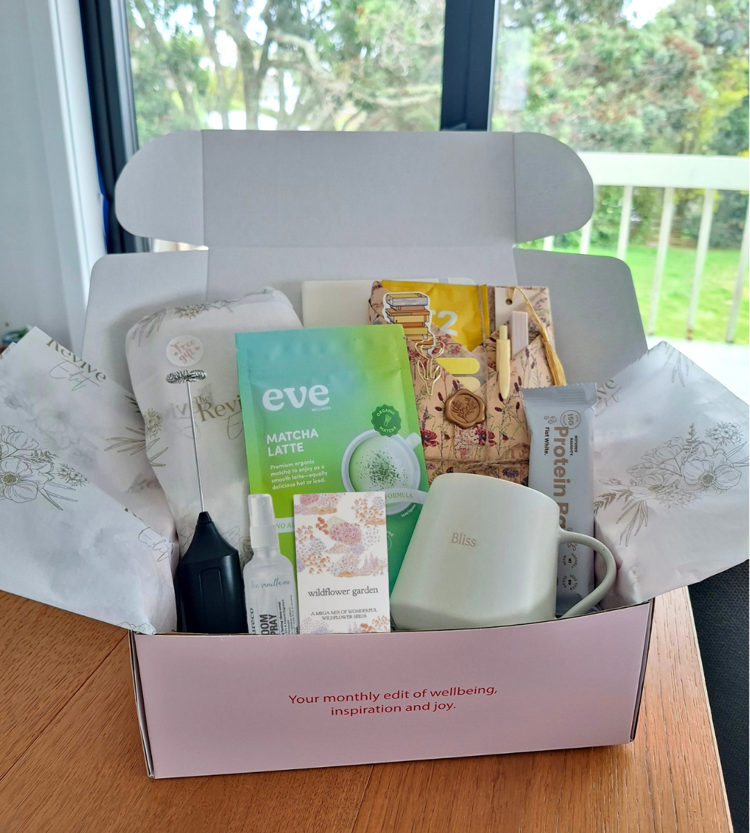 Shop The Revive Edit. box - this is built around one meaningful theme and one small, achievable ritual, a book, a curated set of wellbeing products, and a printed guide to walk you through it