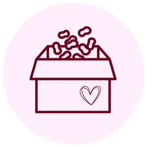 Open box filled with assorted candy and chocolates, with a heart symbol on the box.