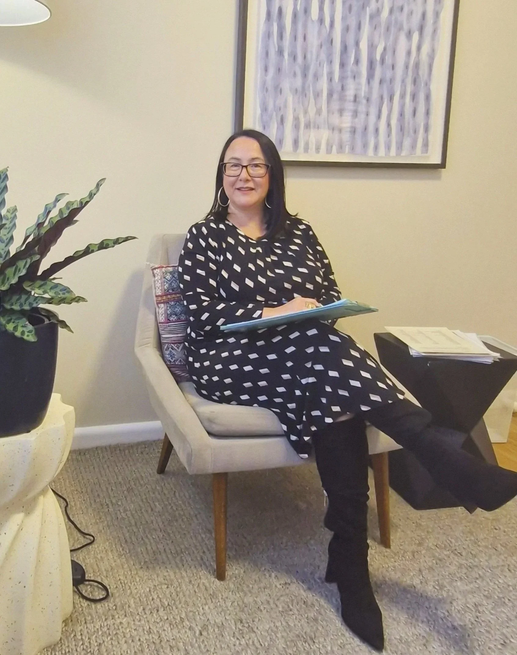 Lian Vandenberg, psychologist, listening in her practice room