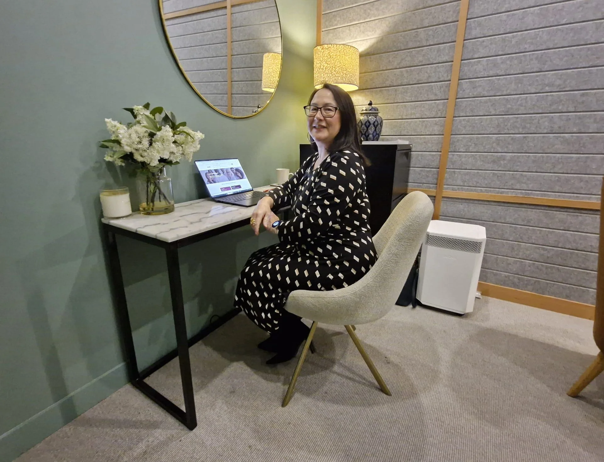 Lian Vandenberg, psychologist, at her desk in her practice room