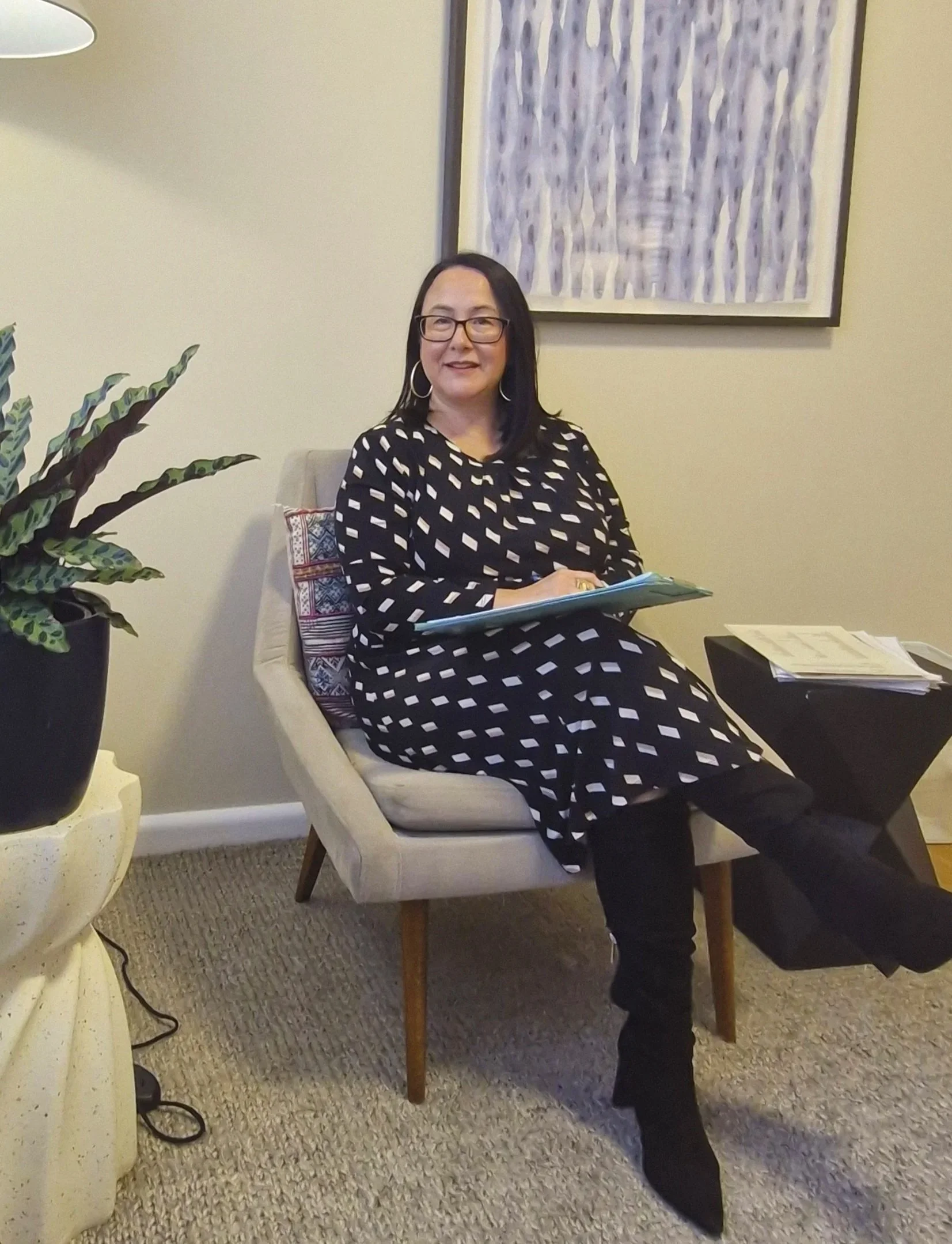 Lian Vandenberg, psychologist, listening in her practice room