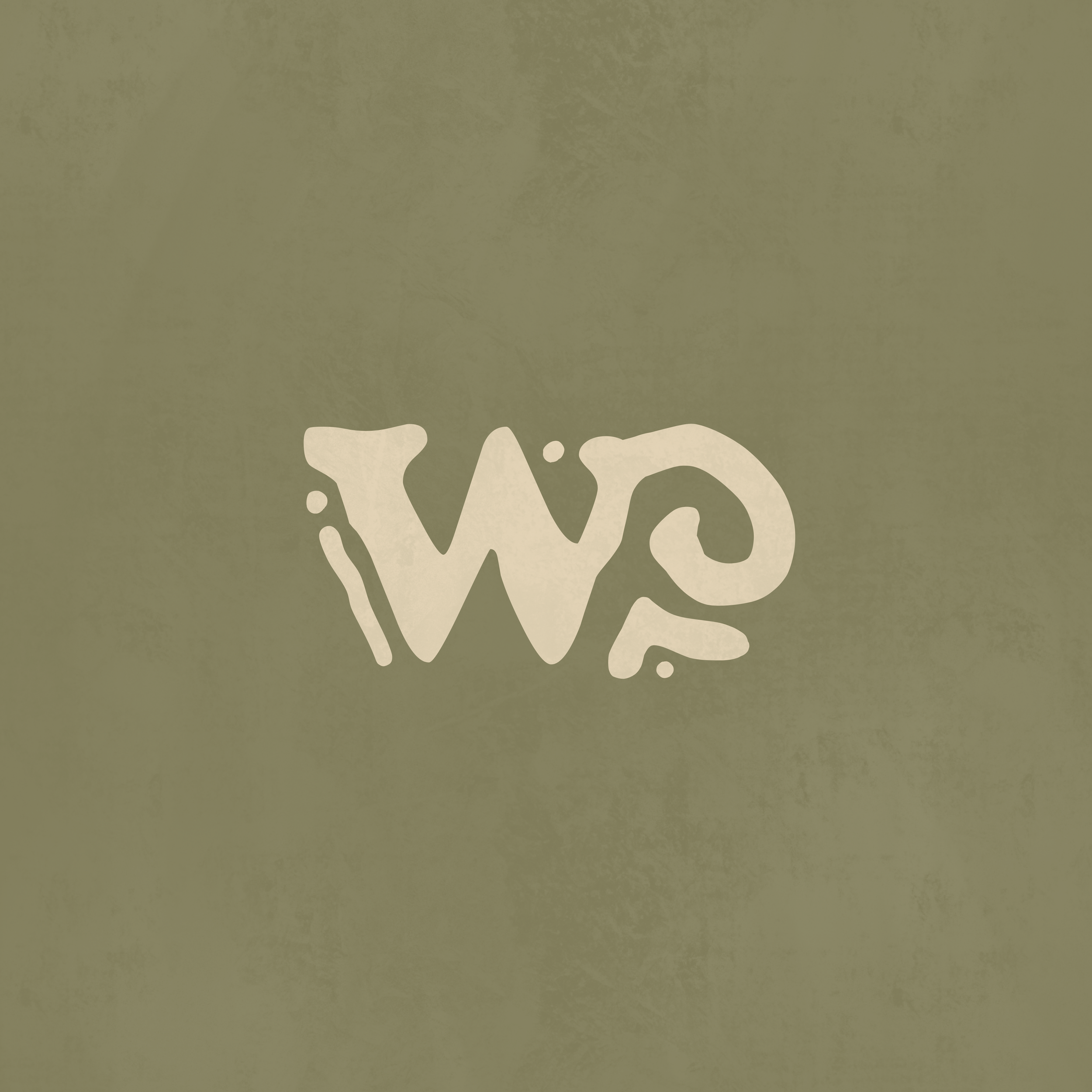 Close-up of a green background with a white, abstract, organic shape at the bottom.